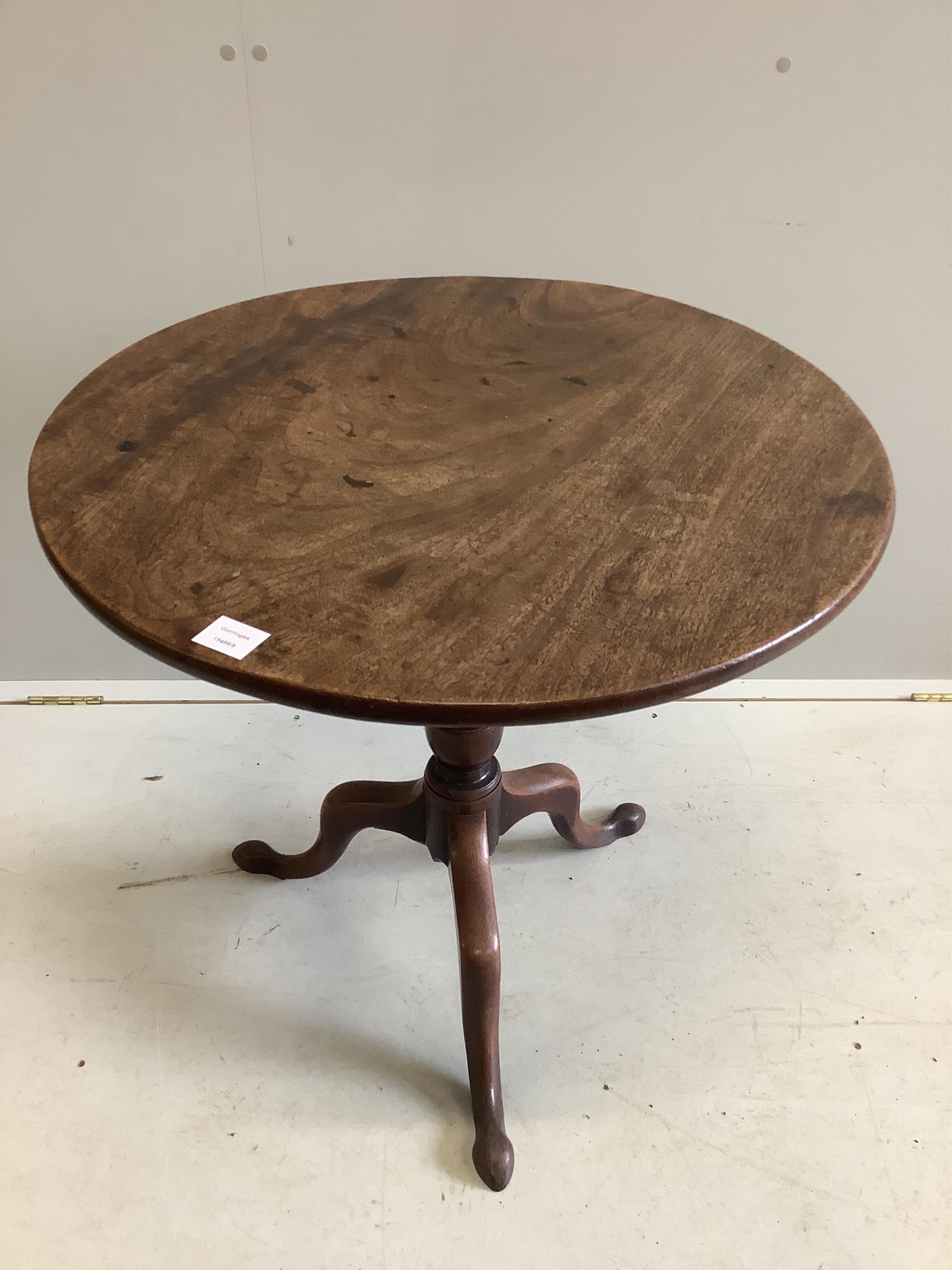 A George III circular mahogany tilt top tea table, diameter 73cm, height 70cm. Condition - fair